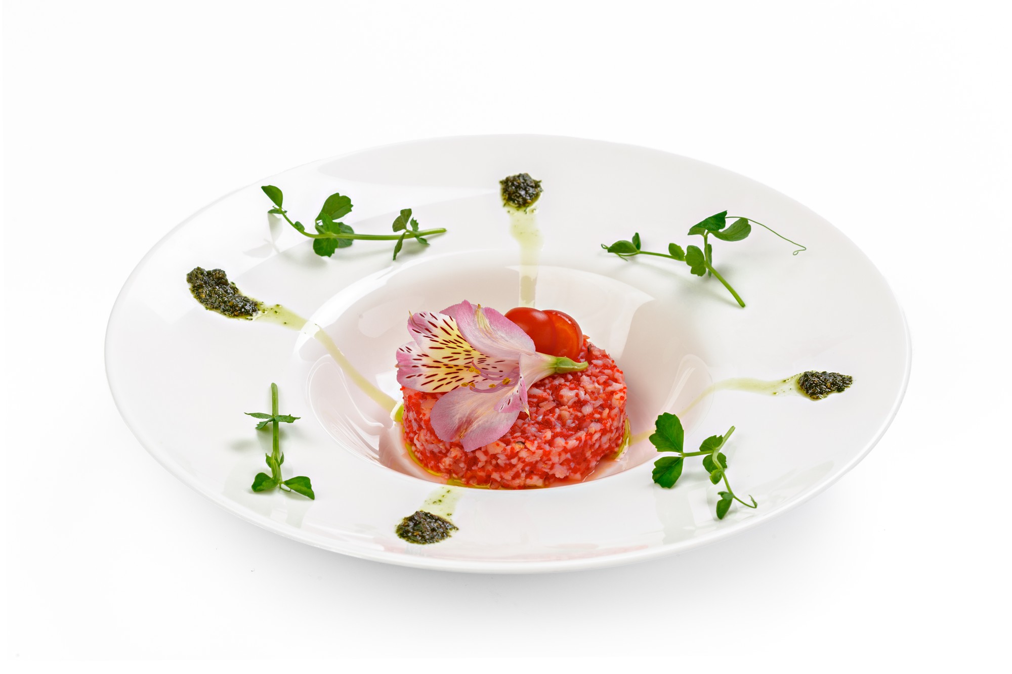 Close-up plated signature dish with garnish